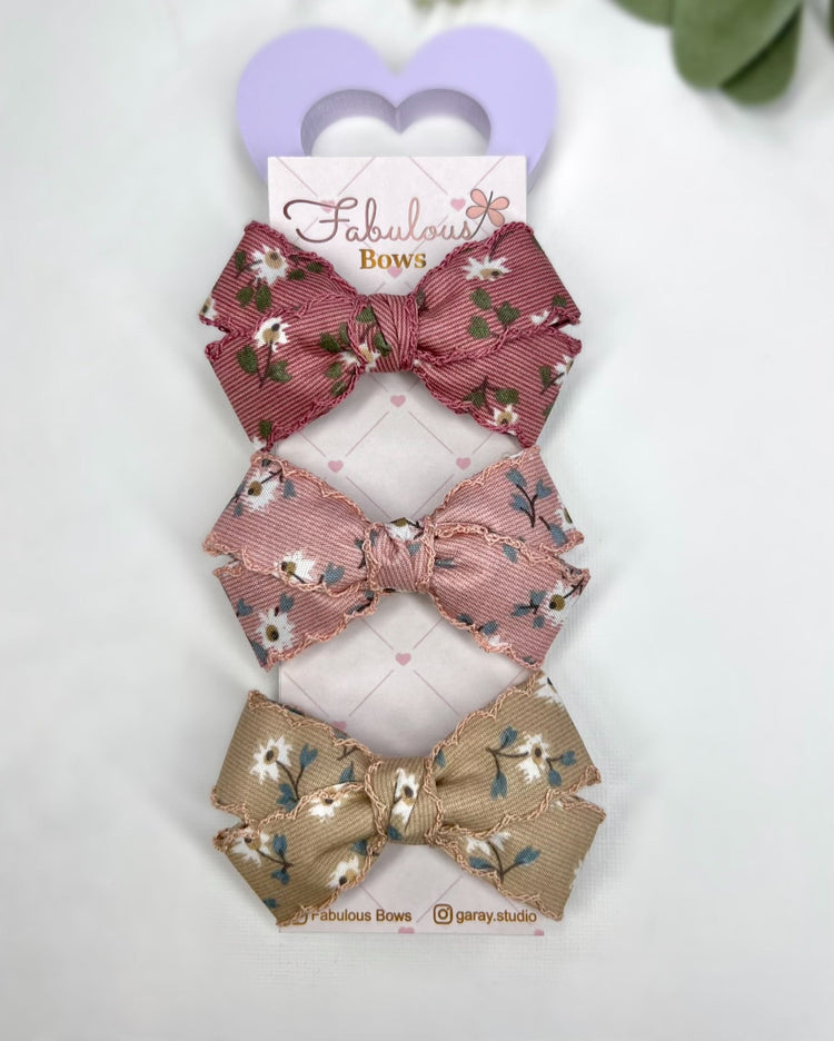 🌸 Sweet floral elegance for your little one! 🌼 These handcrafted bows from Fabulous Bows add a timeless touch to any outfit